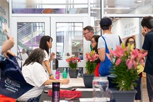 People at a check in table